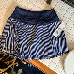Kyodan tennis/golf/pickle/running skort‎ with zip pocket. NWT. Retail 48